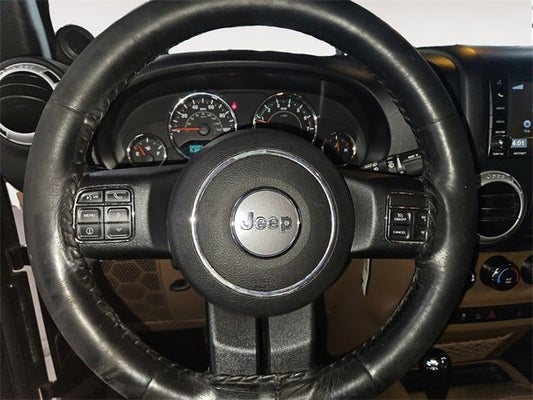 2014 Jeep Wrangler Unlimited Sahara in Grand Haven, MI - Preferred Auto Dealerships